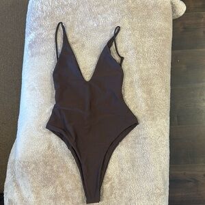 one piece swim suit in brown. No brand name or size.  it is about an XS.